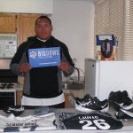 Shawn Lauvao with Big Dawg Possessions Sign