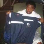 Larry Taylor with Travel Worn & Signed Official Blue & White Connecticut Huskies Full Zip Nike XL Jacket