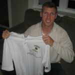 Ryan Spadola with Travel Worn & Signed Official White Lehigh Mountain Hawks Russell Polo Shirt