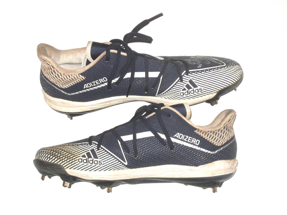 A detailed view of the Adidas baseball cleats worn by Cristian