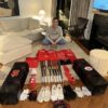 Stuart Fairchild with 2024 Cincinnati Reds Game Worn & Signed Black & Red Franklin Batting Gloves