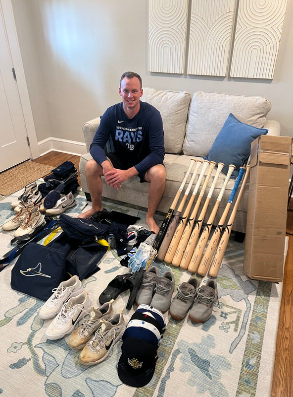 Logan Davidson with 2026 Durham Bulls Game Worn & Signed White & Yellow Franklin Batting Gloves